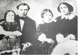 Помещики села Дубки Шлыковы Василий и Аделаида с дочерьми Раисой и Виргинией, 1858
